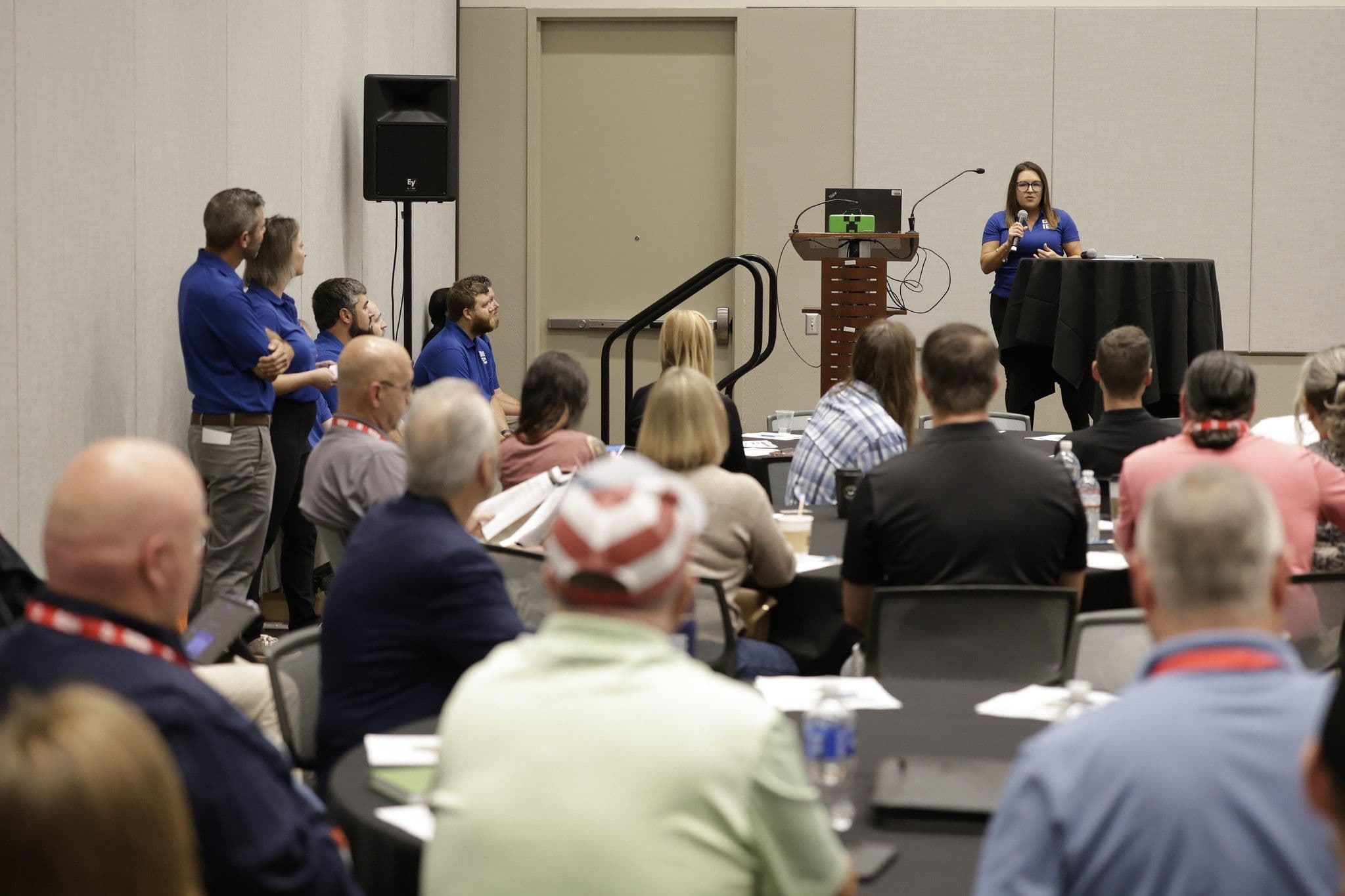 A presenter speaking to electrical contractors at IEC SPARK