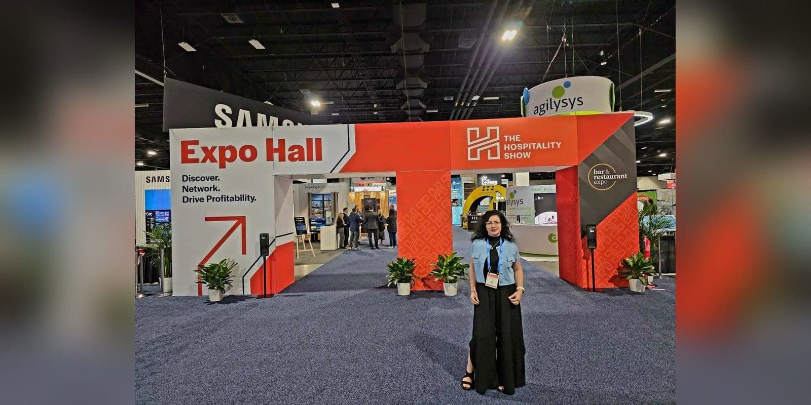 The Hospitality Show 2025 expo entrance in Denver with an attendee in front of the hall