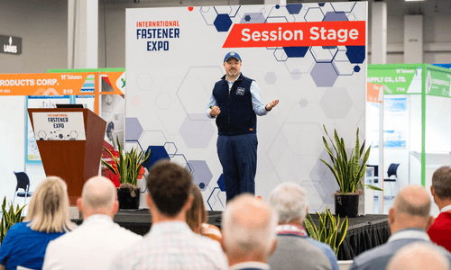 Speaker addressing the International Fastener Expo session stage in 2023