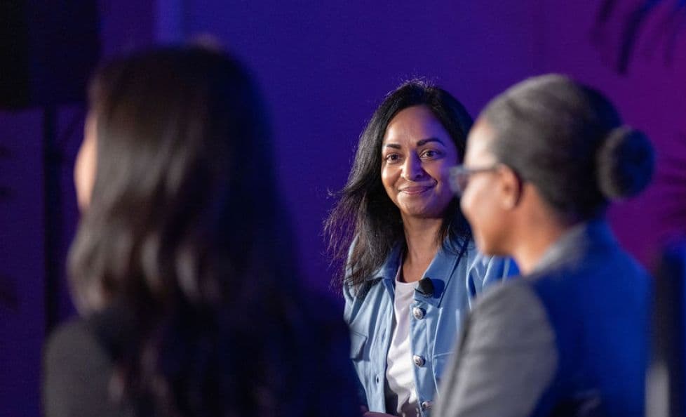 PMI Global Summit panellist speaking with two fellow project professionals