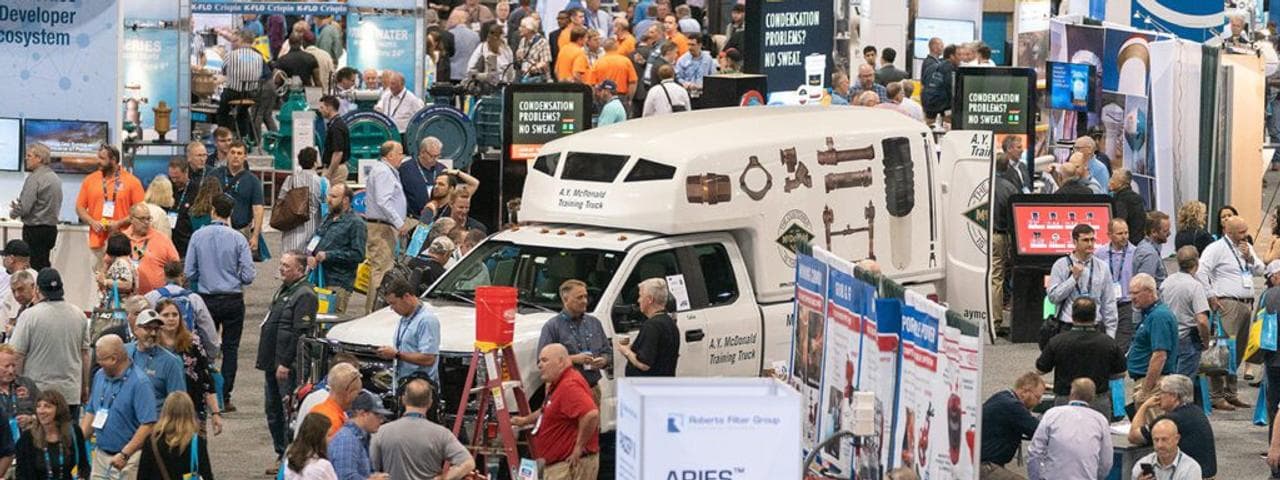 WaterSmart Innovations 2025 expo floor with attendees and water-technology exhibits