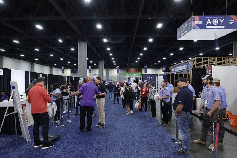 Contractors and exhibitors on an IEC SPARK expo floor