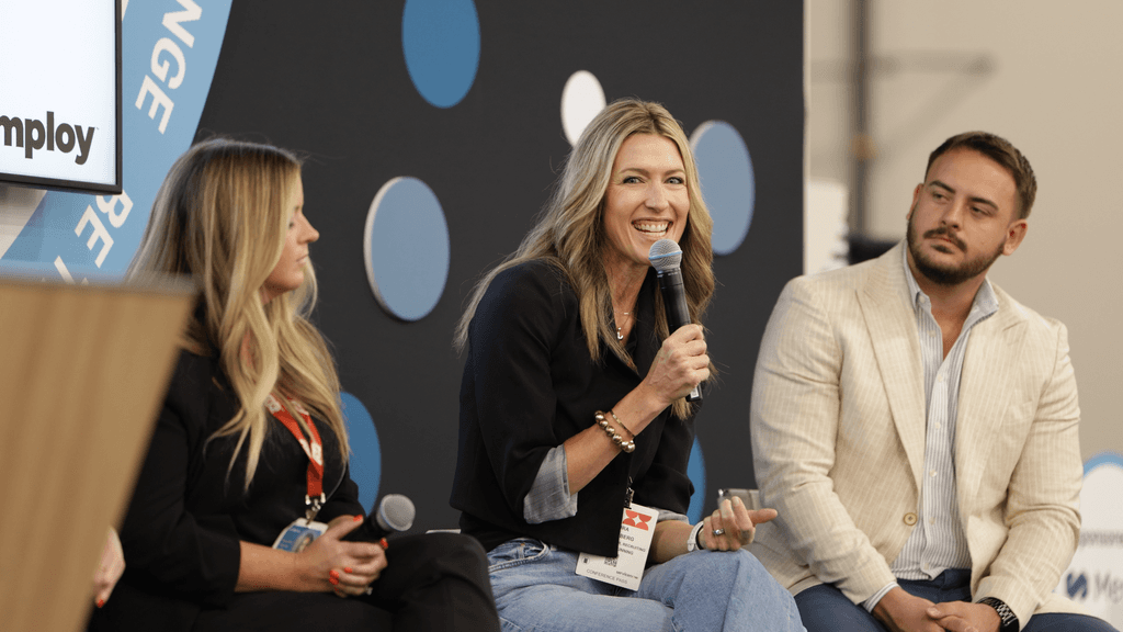 Three speakers taking part in an expo-stage discussion at HR Tech 2025
