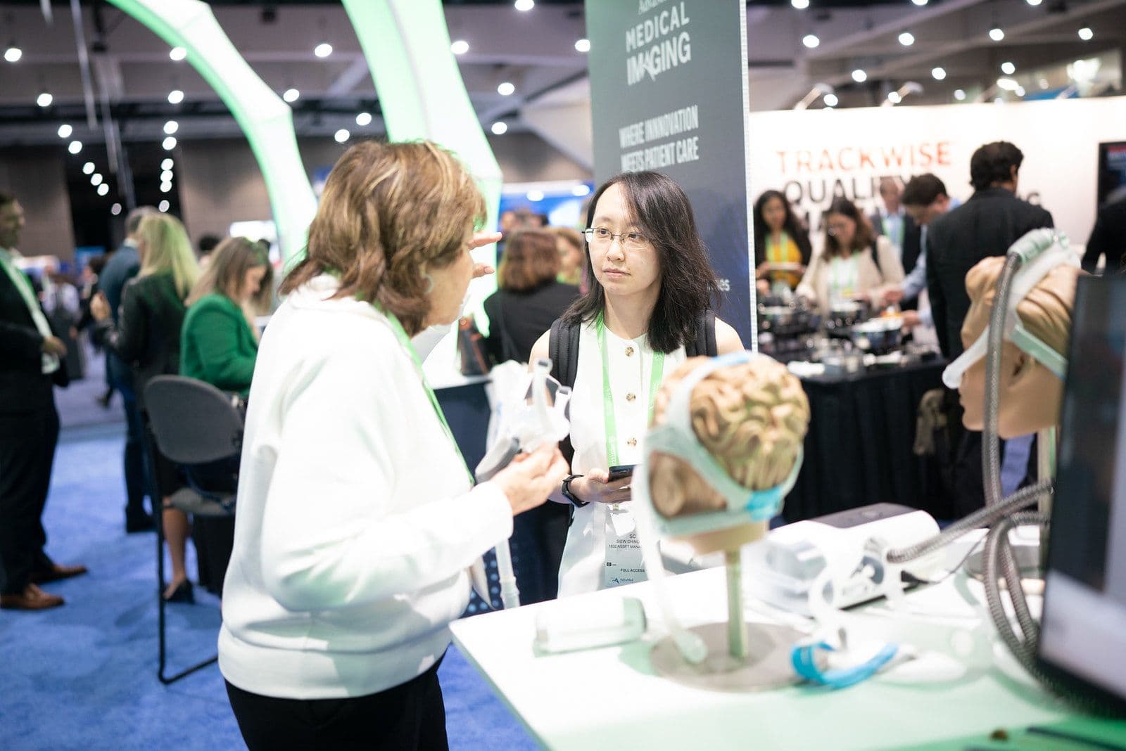 Attendee viewing a medical-imaging demonstration on The MedTech Conference 2025 exhibit floor