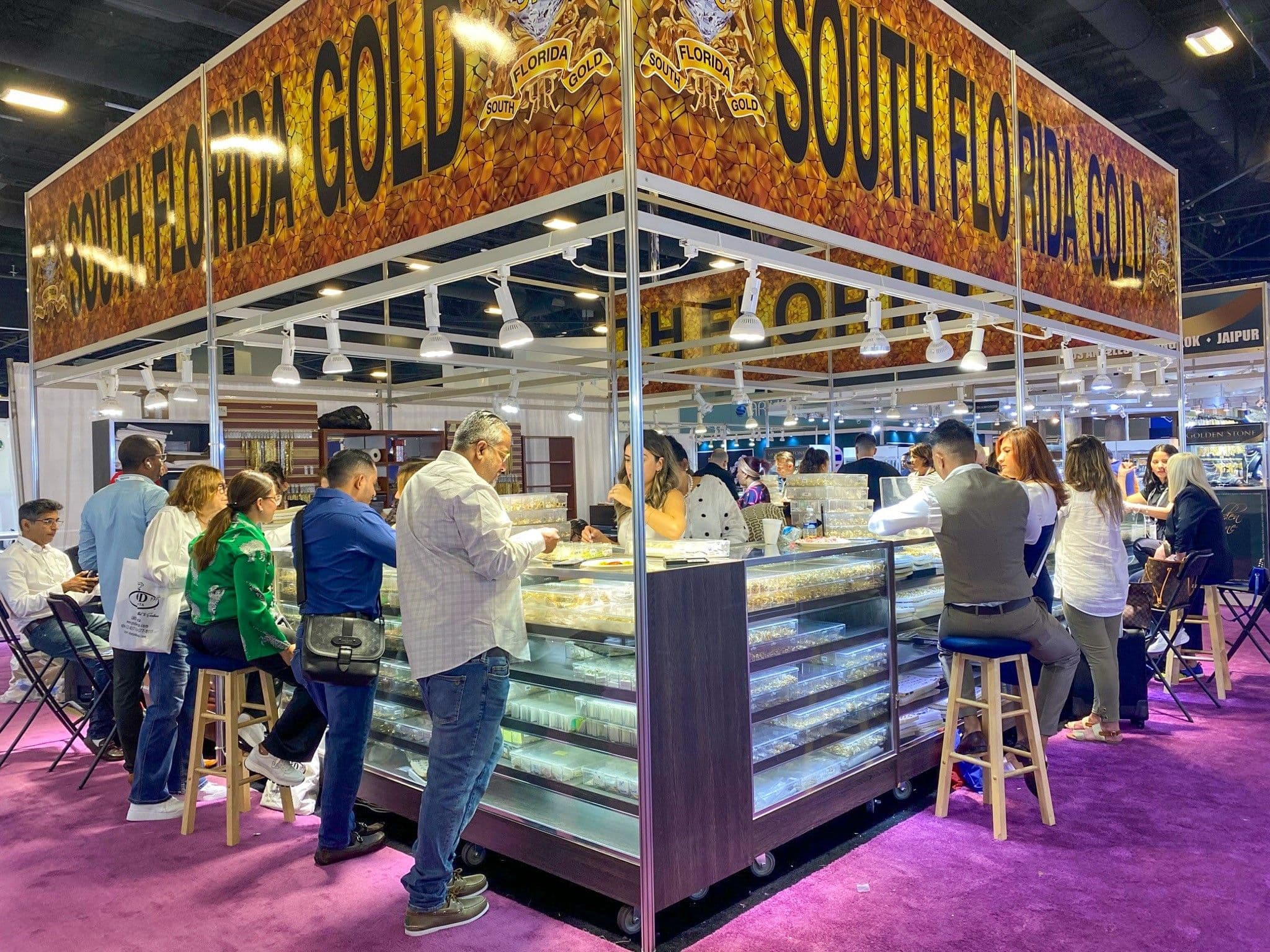 Buyers meeting exhibitors at the South Florida Gold booth during JIS Fall 2023 in Miami Beach