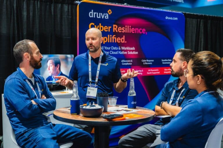 Sponsor team stands at an InfoSec World 2025 expo booth