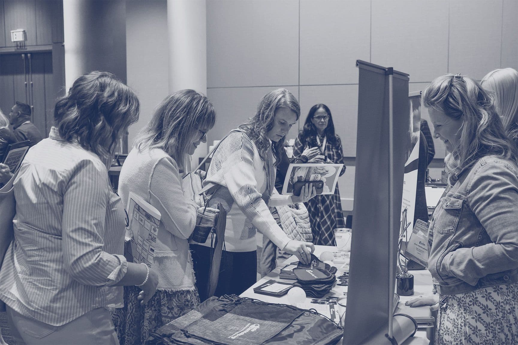 People engaging with sponsor tables at the 2025 Customer Connections Conference
