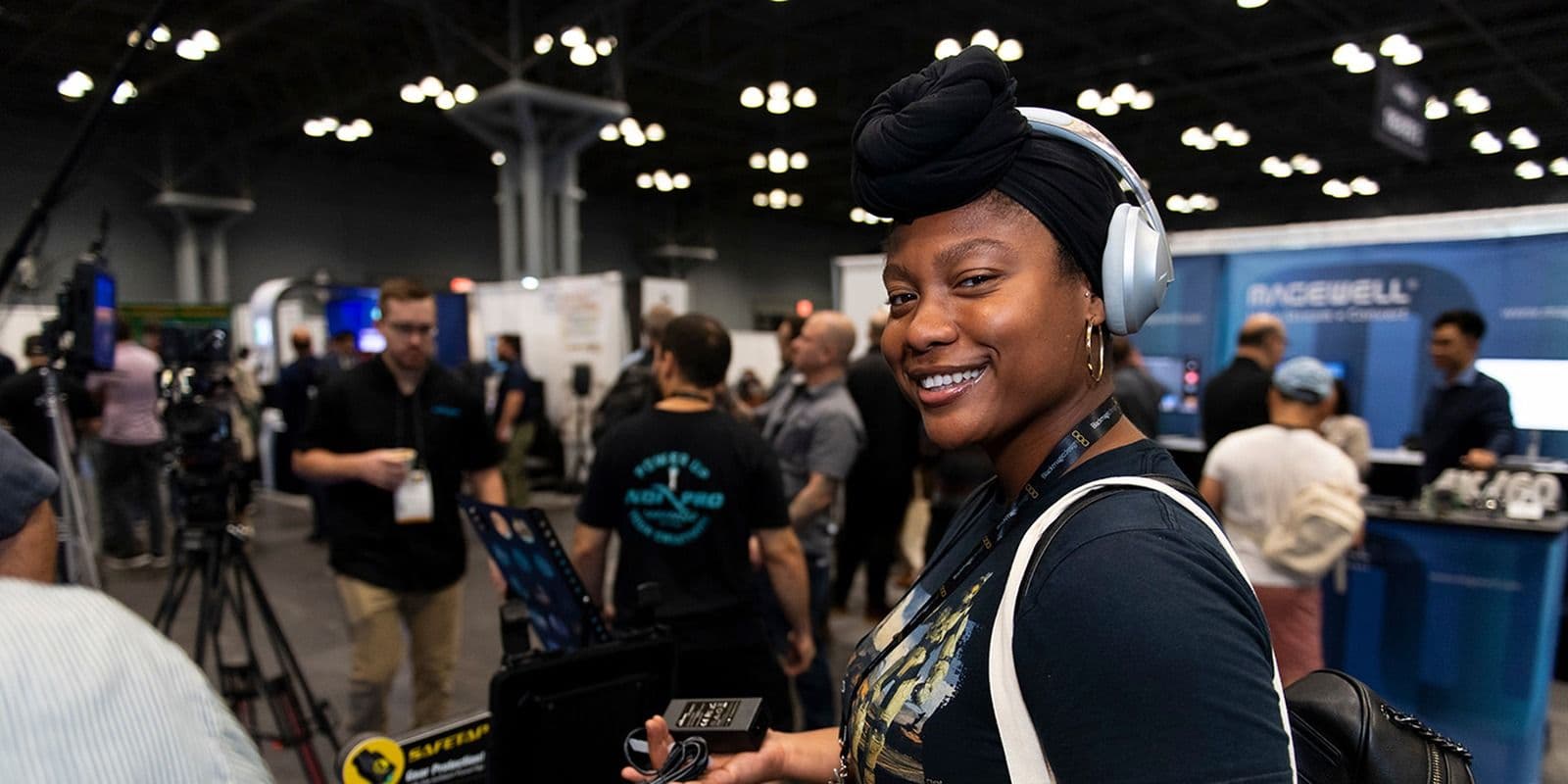 Attendee trying production equipment on the NAB Show New York 2024 exhibition floor