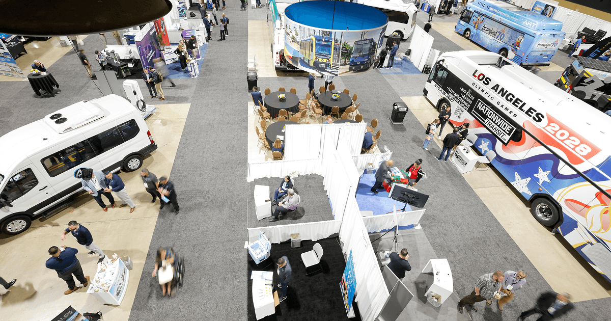 Transit vehicles and display booths on the expo floor
