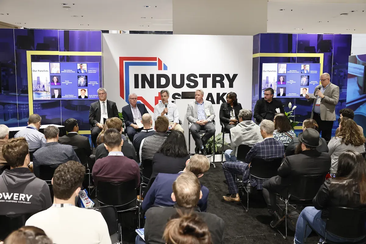 A panel addresses attendees at the Industry Speaks stage during PACK EXPO International 2024.
