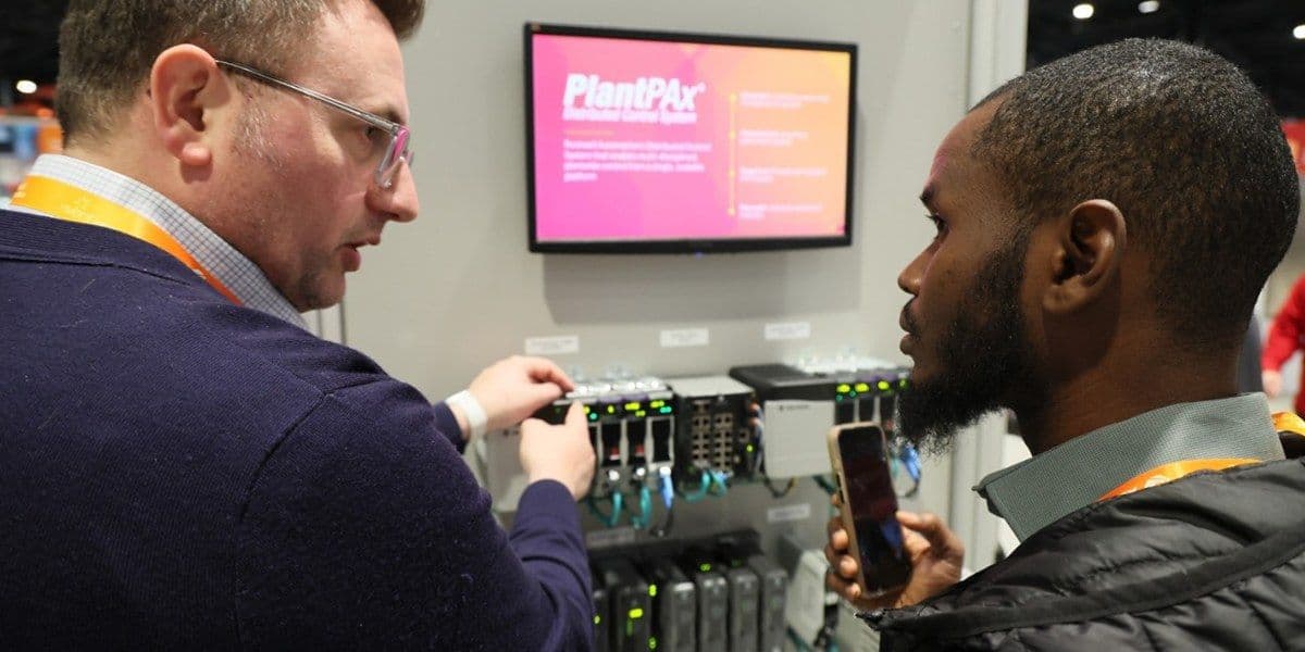 Attendees meeting partner exhibitors at Automation Fair 2025