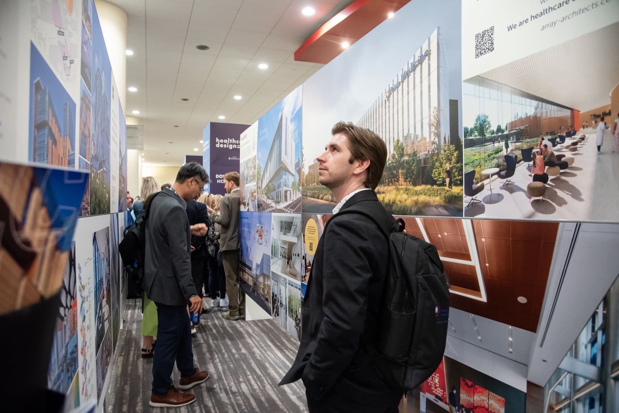 Attendees viewing healthcare architecture boards in the HCD project gallery in 2024