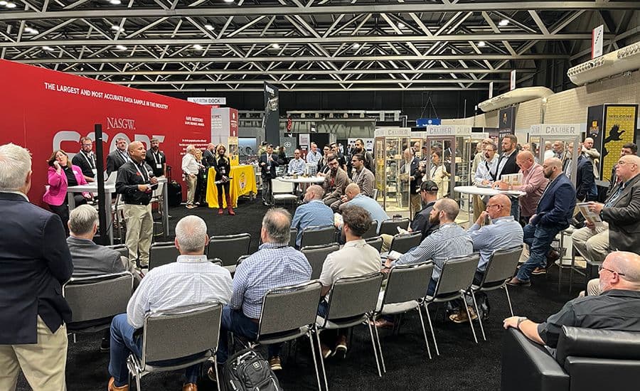 Attendees seated for a NASGW SCOPE data session at NASGW Expo 2024, with a presenter beside the SCOPE backdrop