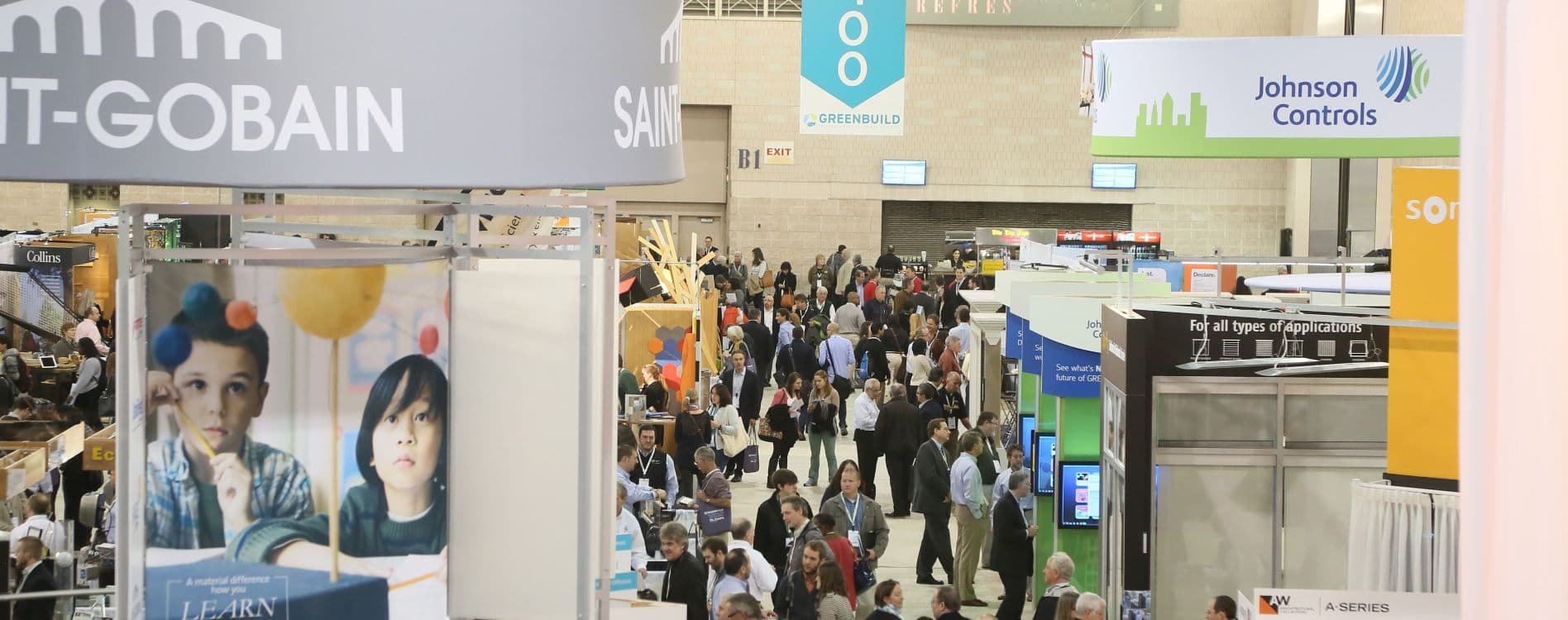 Greenbuild 2024 attendees meeting across the exhibition floor