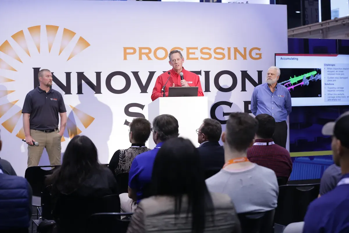 Presenters speak to an audience at the Processing Innovation Stage during PACK EXPO International 2024.