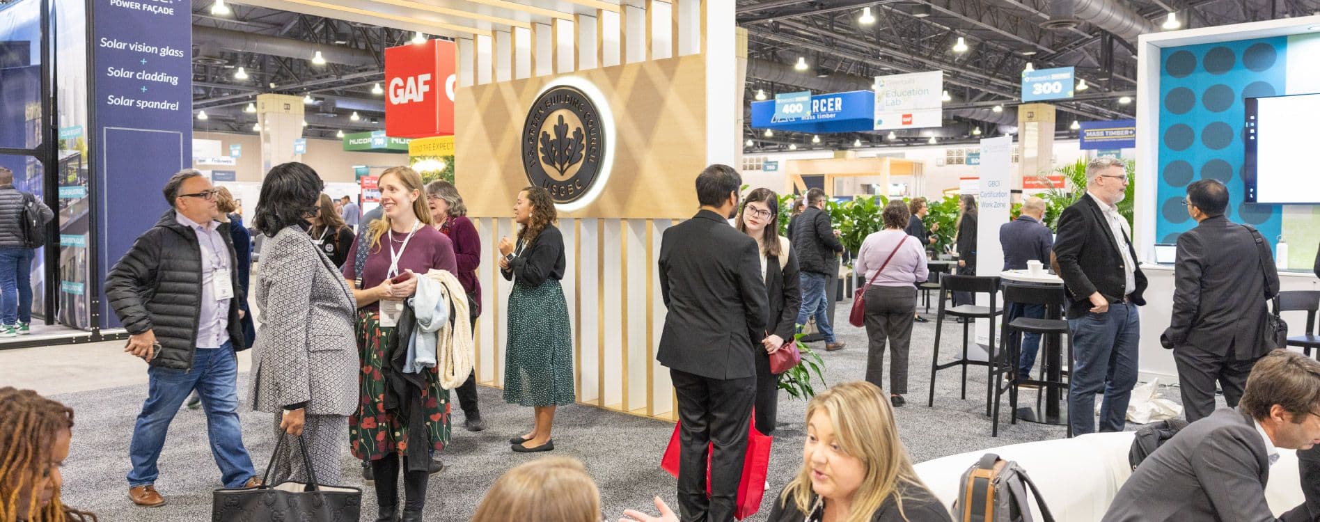 USGBC and GBCI exhibition booth with attendees at Greenbuild 2025