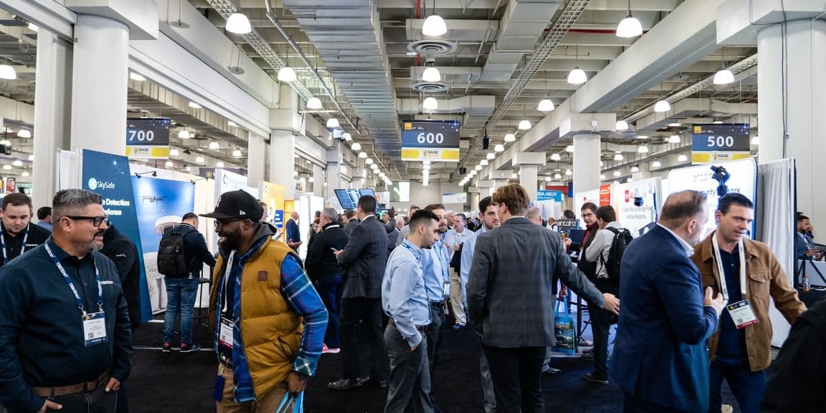 Attendees walking the ISC East exhibition floor in 2024