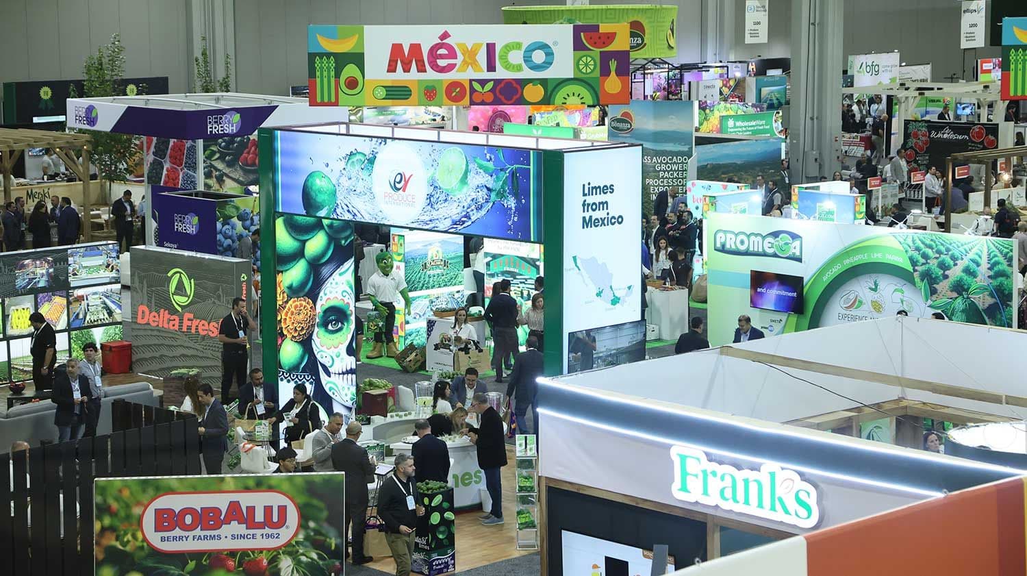 Overhead view of the Global Produce & Floral Show Expo floor with the Mexico pavilion, branded booths and crowded aisles