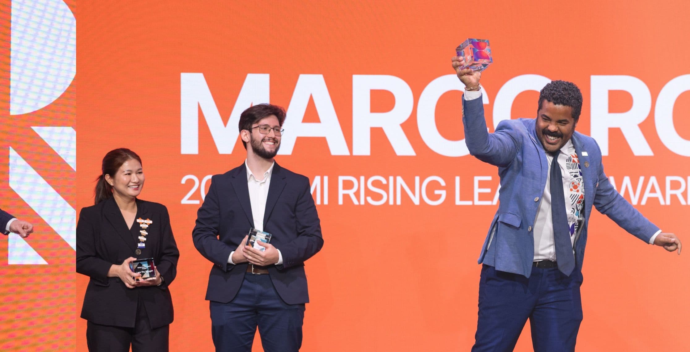 Three PMI Rising Leader Award recipients on the Global Summit stage
