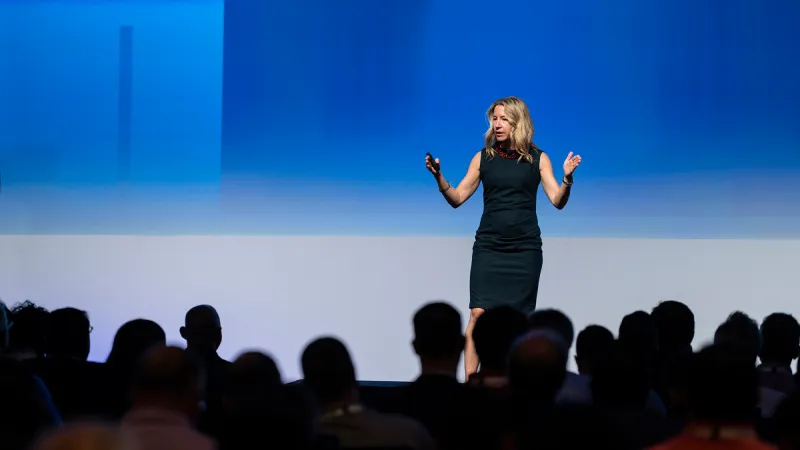 Speaker presenting on stage to the Gartner IT Symposium/Xpo 2025 audience