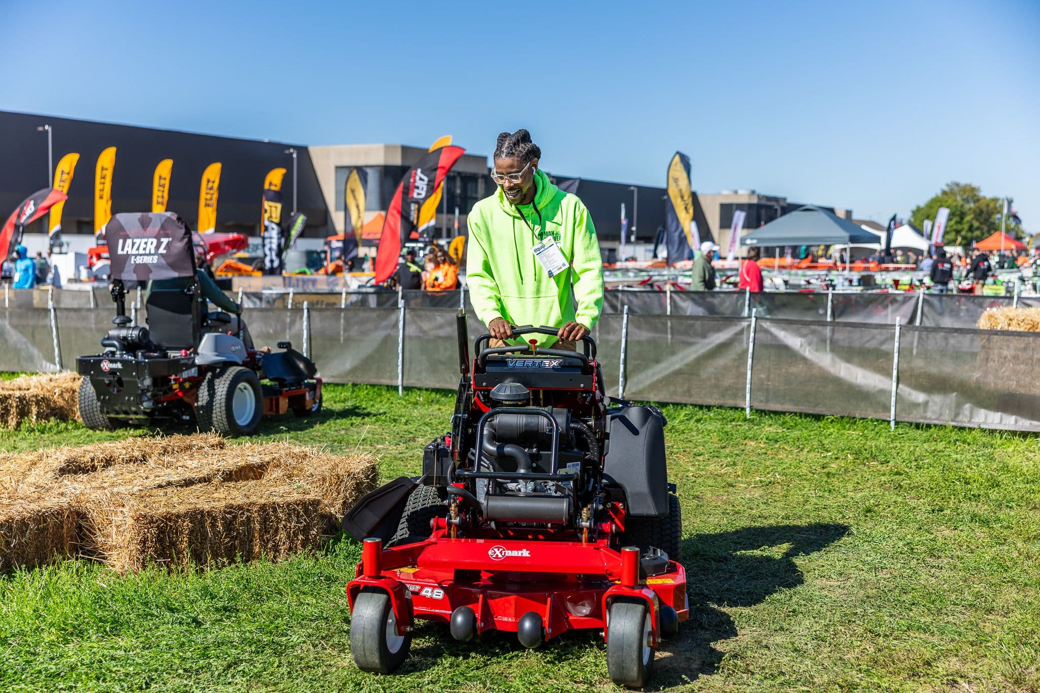 Equip Exposition 2025 attendee testing a commercial mower in the Outdoor Demo Yard