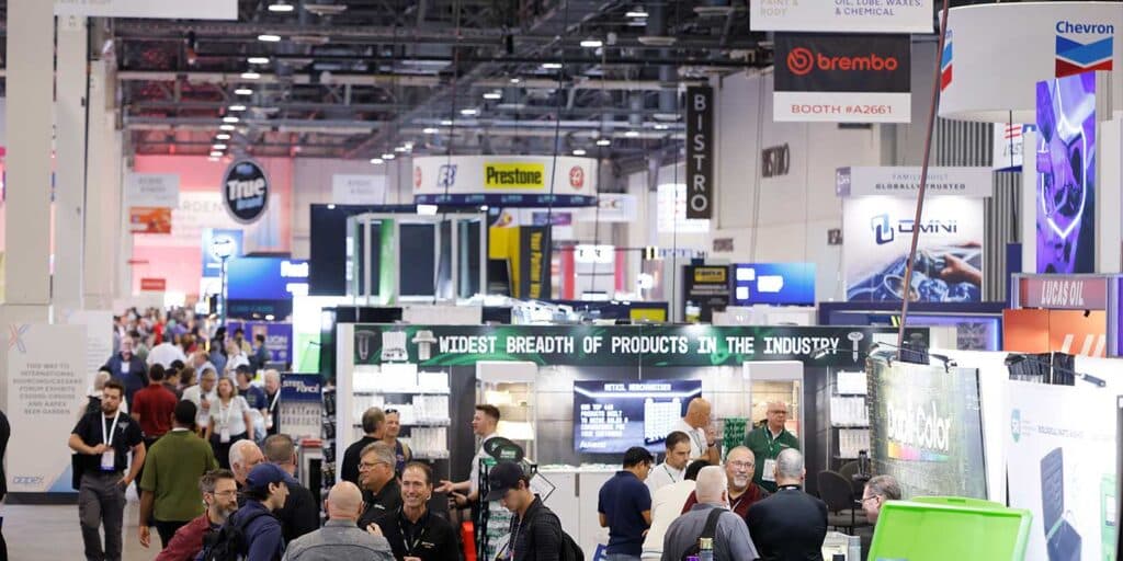 Crowded AAPEX 2025 show floor with exhibitors and visitors