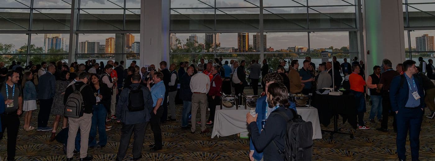 Attendees exploring supplier booths on the EV Tech Expo and Battery Show floor